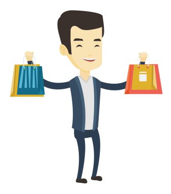 mutlu bir adam holding alışveriş torbaları.