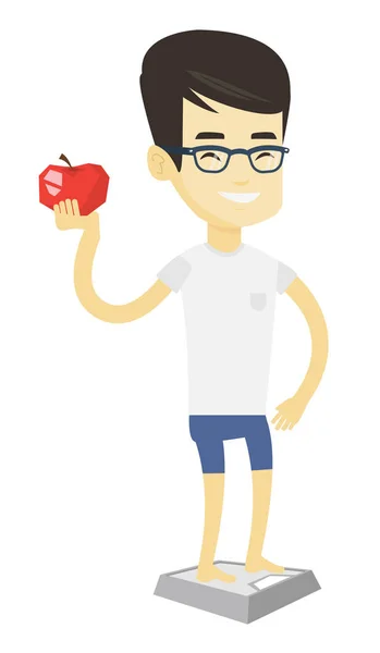 Uomo in piedi sulla scala e tenendo la mela in mano . — Vettoriale Stock