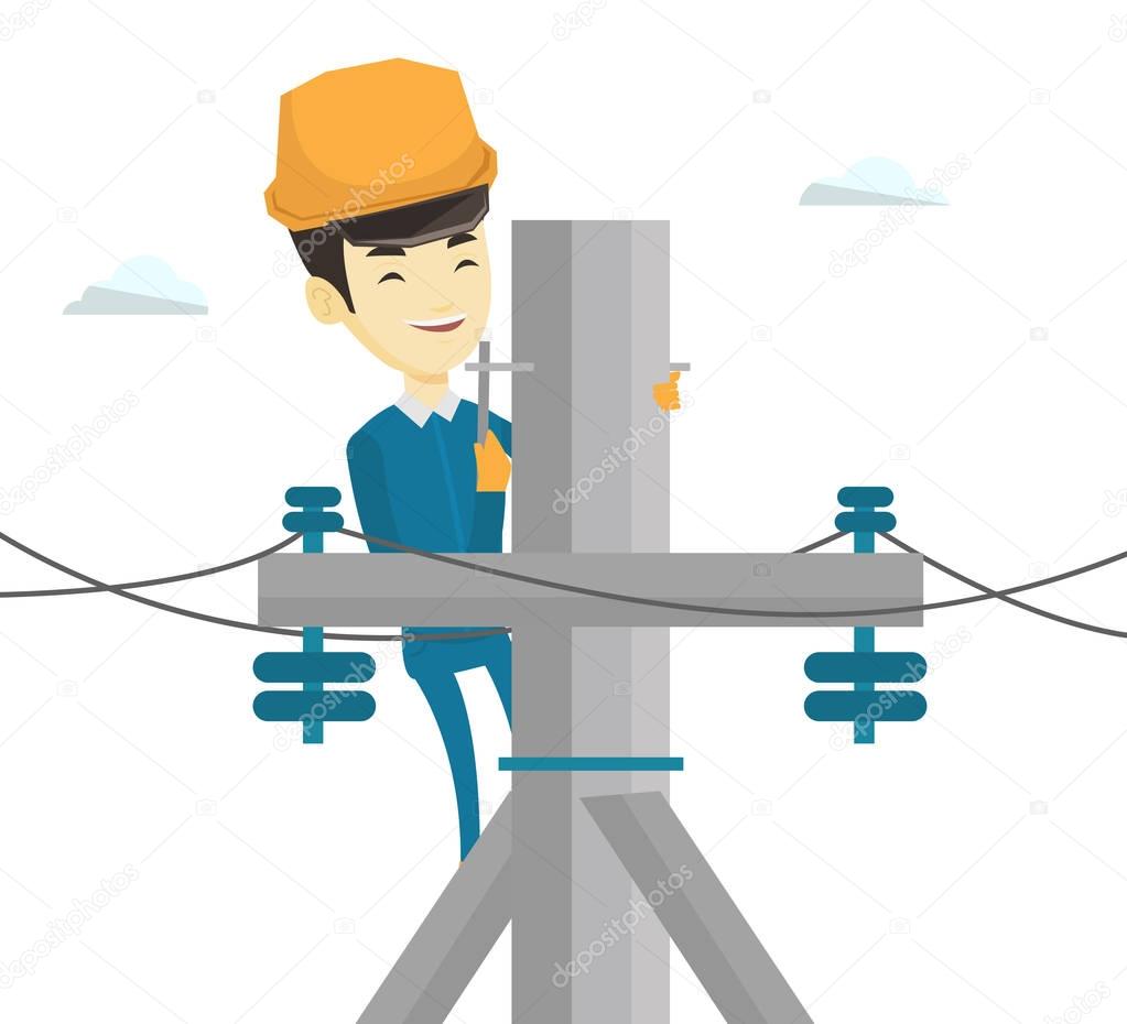 Electrician working on electric power pole.