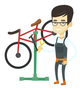 Asya Bisiklet mekanik tamir dükkanında çalışan.