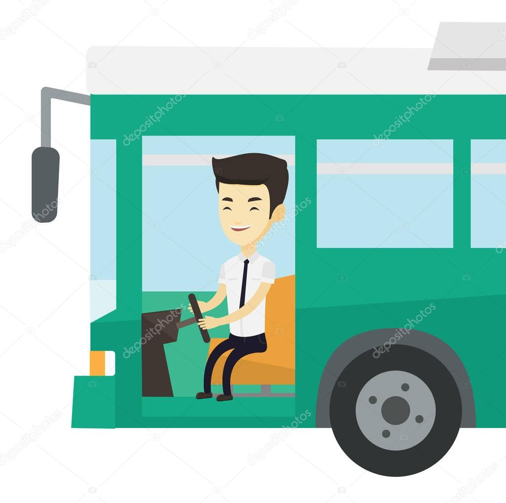 Asian bus driver sitting at steering wheel.