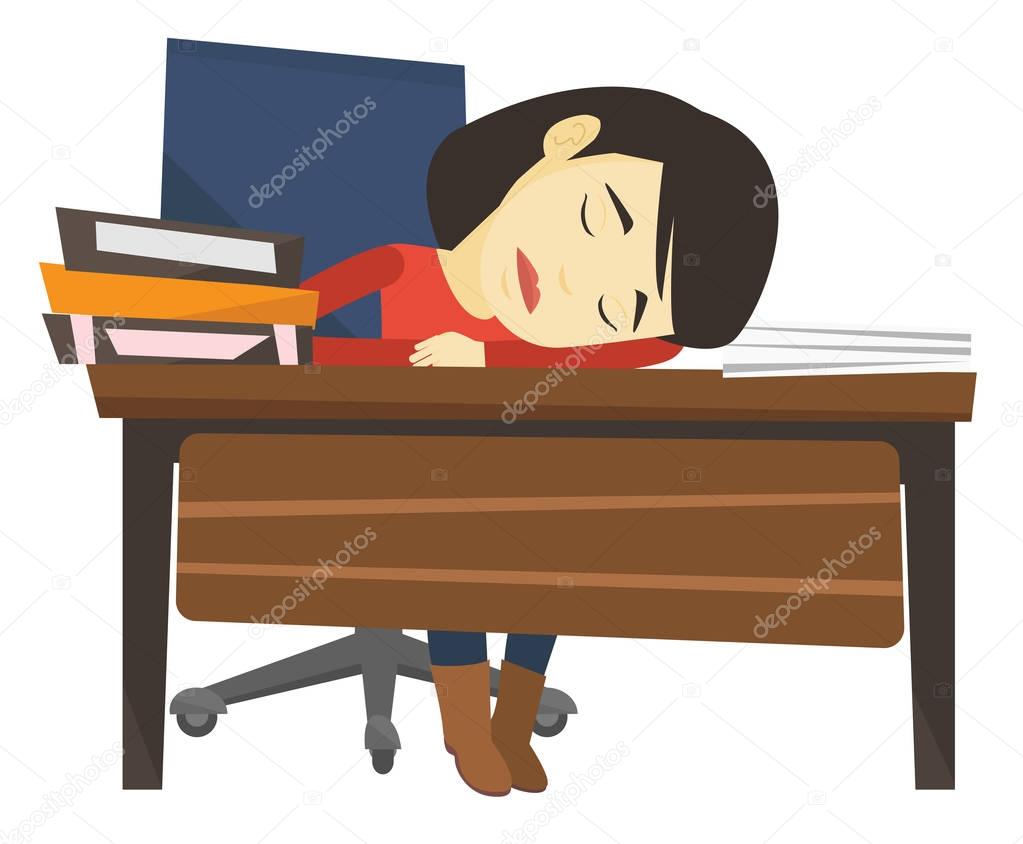 Student sleeping at the desk with book.