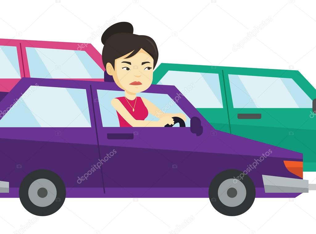Angry asian woman in car stuck in traffic jam.