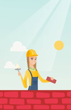 Duvarcı ustası spatula ve tuğla ile çalışma.