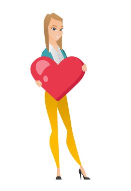 Büyük kırmızı bir kalp tutan beyaz iş kadın.