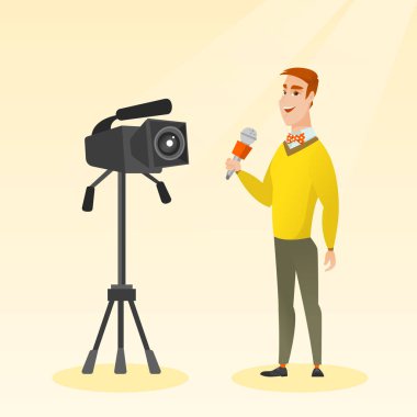 TV muhabiri ile bir mikrofon ve bir fotoğraf makinesi.