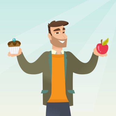 Adam bir elma ve çörek arasında seçim yapma.