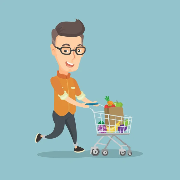 Hombre corriendo con un carro lleno de compras . — Vector de stock