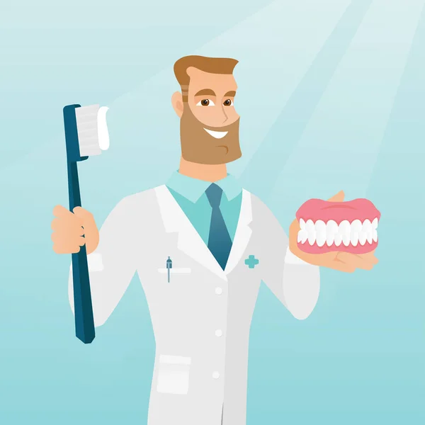 Dentist with a dental jaw model and a toothbrush.