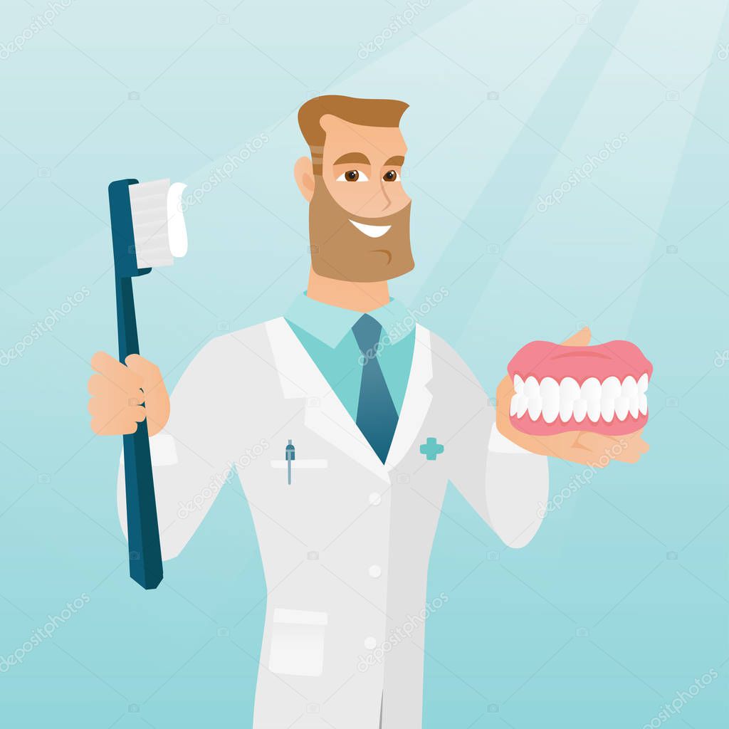 Dentist with a dental jaw model and a toothbrush.