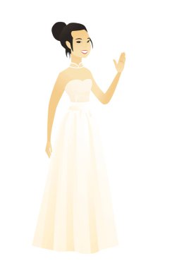 Genç Asyalı gelin elini sallayarak.