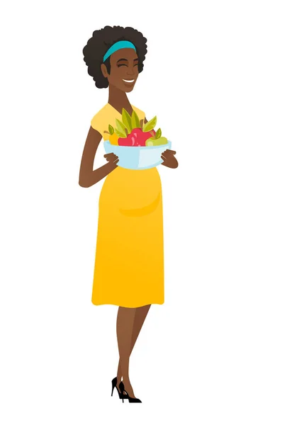 Young pregnant woman with bowl of fruits. — Stock Vector