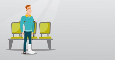 Kırık bacak ve koltuk değneği olan adam.