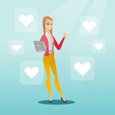 Kadın ile laptop ve kalp kutsal kişilerin resmi.