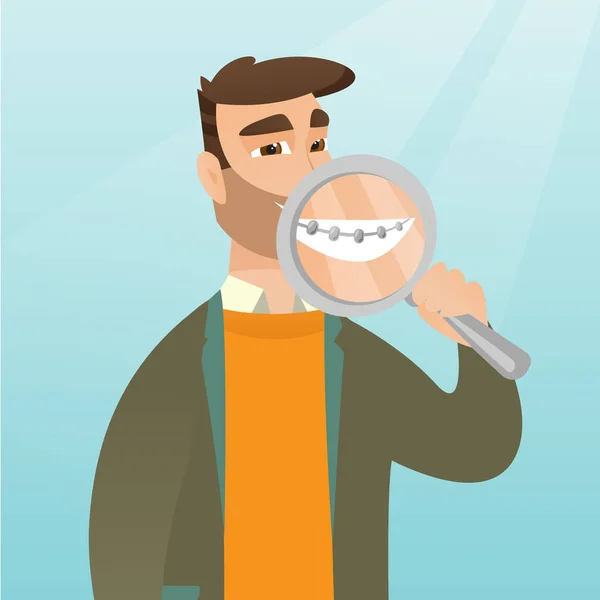 Hombre examinando sus dientes con una lupa . — Vector de stock