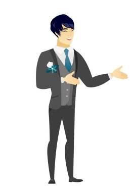 Genç Asyalı mutlu damat el hareketi.