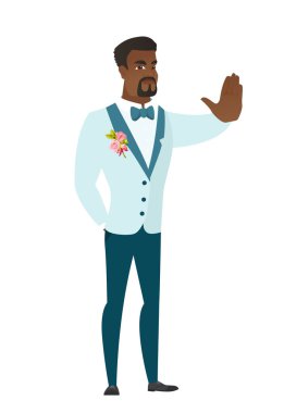 Afrikalı-Amerikalı damat stop el hareketi gösterilen.