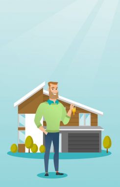 Genç beyaz ev sahibi ile anahtar.