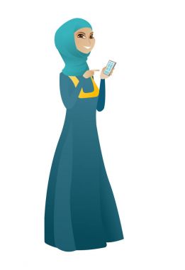 Bir cep telefonu tutan Müslüman iş kadın.