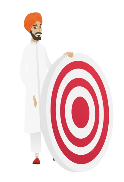 Young hindu businessman and dart board. — Stock Vector