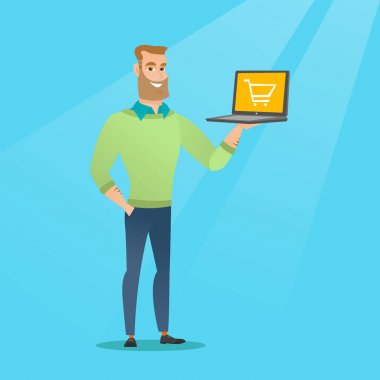 Laptop bir ekranda arabası ile tutan adam.