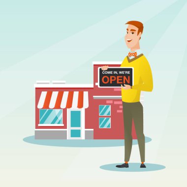 Açık tabela holding beyaz dükkan sahibi.