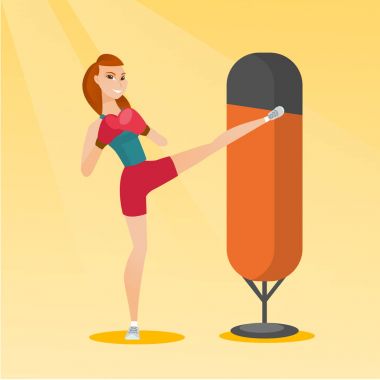 Young caucasian woman exercising with punching bag clipart