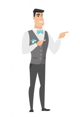 Genç beyaz damat tarafına işaret.