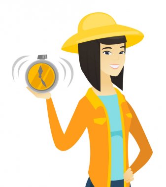 Çalar saat tutan genç Asyalı çiftçi.