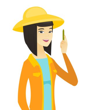 Kalem ile genç Asyalı çiftçi.