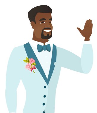 Genç Afro-Amerikan damat elini sallayarak.