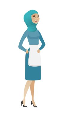 Genç Müslüman süpürge gülüyor.