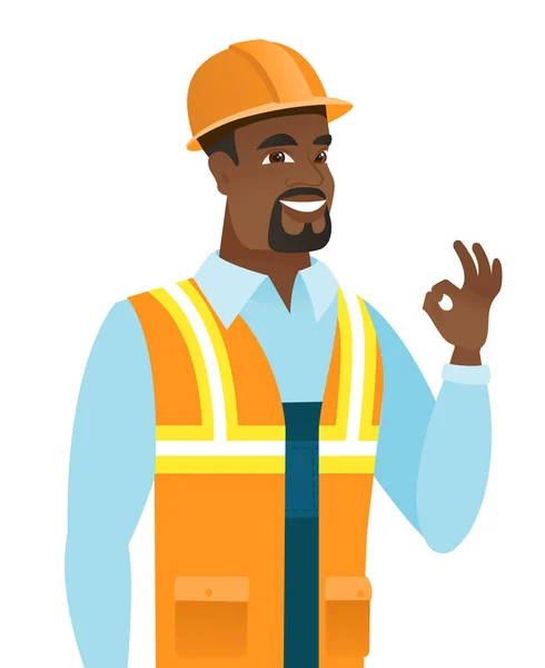 Afro-americano sonriente constructor mostrando ok signo . — Vector de stock