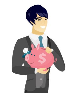 Genç Asyalı damat bir kumbara holding.