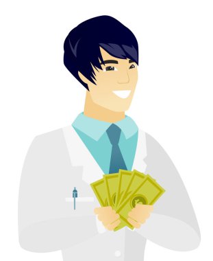 Genç Asyalı doktor holding para.
