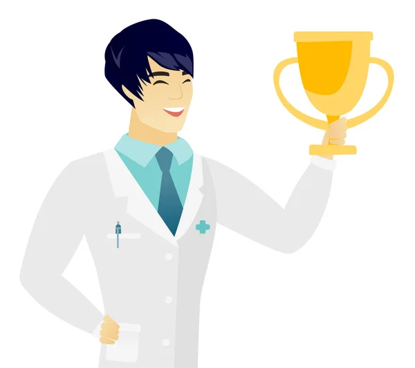 Young asian doctor holding a golden trophy. — Stock Vector