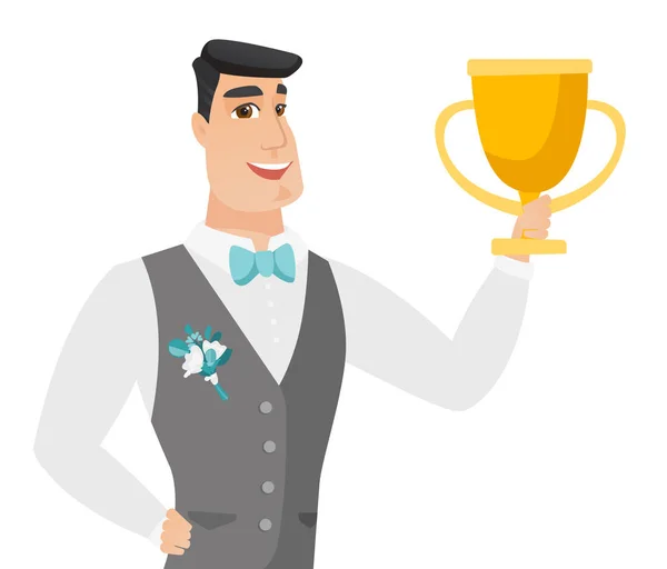 Young caucasian groom holding a trophy. — Stock Vector