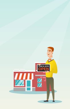 Açık tabela holding beyaz dükkan sahibi.