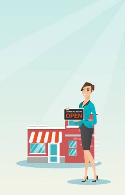 Açık tabela holding beyaz dükkan sahibi.