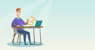 Beyaz adam alışveriş torbaları bir laptop elde.