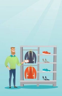 Adam bir fiyat etiketi bir giyim mağazası tarafından şok.