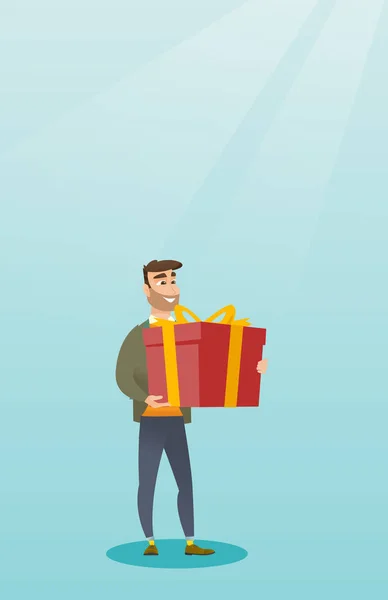 Young caucasian man holding box with gift. — Stock Vector