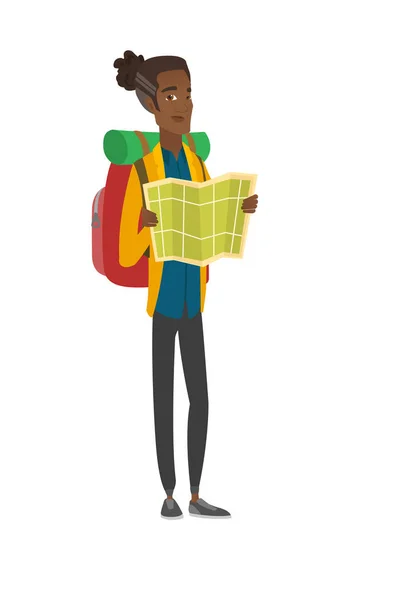 African traveler with backpack looking at map. — Stock Vector