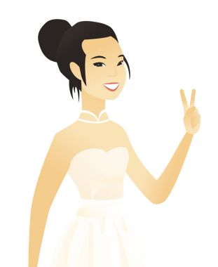 Genç Asyalı nişanlısı zafer jest gösterilen.