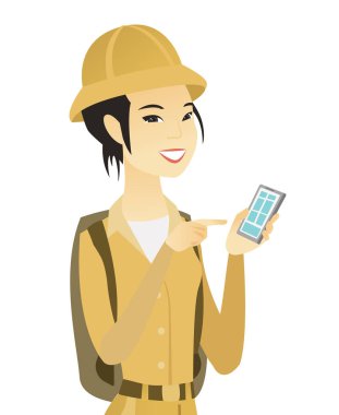 Bir cep telefonu tutan genç Asya seyahat.