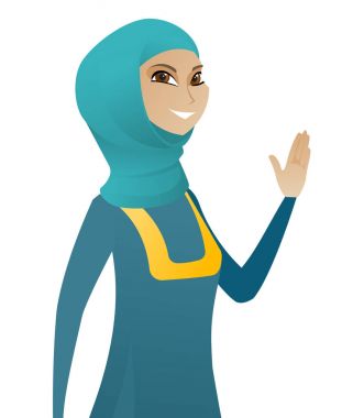 Elini sallayarak genç Müslüman iş kadını.