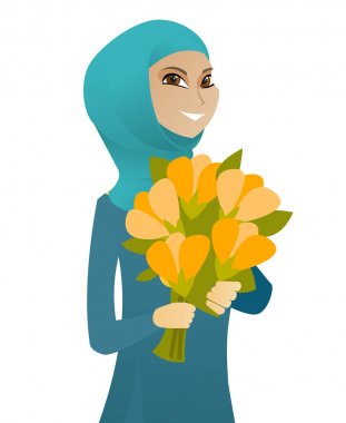 Buket çiçek tutan Müslüman iş kadın.