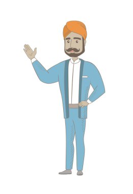 Hindu işadamı bir şeye el ile işaret.