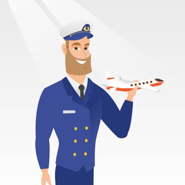 Cheerful airline pilot with the model of airplane. clipart