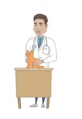 Genç İspanyol veteriner muayene kedi.